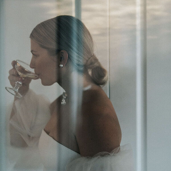 Bride sipping champagne - Revelle Bridal Ottawa - 2022 Wedding Trend Predictions.