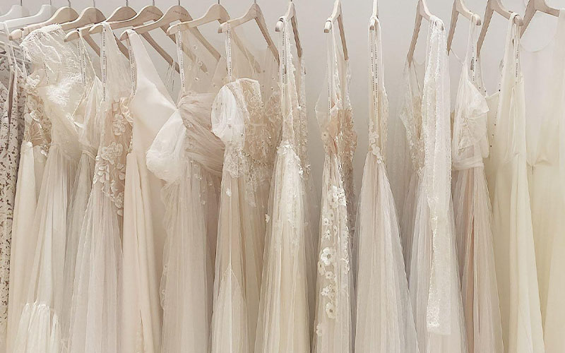 Revelle Bridal Boutique Ottawa - Row of Boho Bridal Gowns Hanging on Rack
