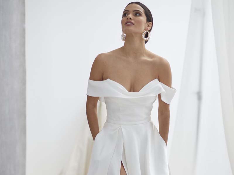 Hera Couture Trunk Show at Revelle Bridal Modern Silk Satin Wedding Gown Off-The-Shoulder Leg Slit wedding Dress