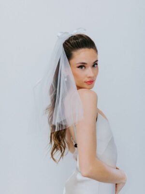 Untamed Petals sweet, simple and classic mini veil hand sewn to a barrette for easy placement. Shipping available across Canada with Revelle Bridal.