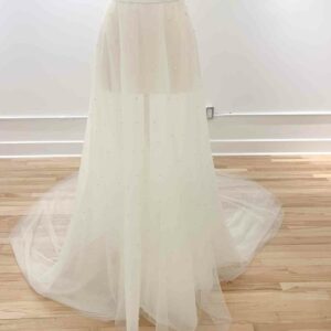 Ali Overskirt on Mannequin by untamed Petals available for purchase at Revelle Bridal Ottawa