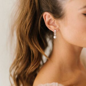 Serenade Earrings by Untamed Petals available for purchase at Revelle Bridal Ottawa Wedding Jewelry Crystal stud earrings with pearl drop Bridal Jewellery