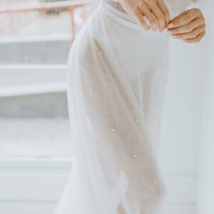 Ali Overskirt Close up by untamed Petals available for purchase at Revelle Bridal Ottawa