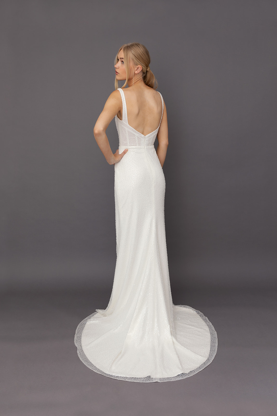 Banks Wedding Dress by Tara Lauren – fully beaded square neck fitted gown with boned corset bodice and draped faux wrap skirt with slit.