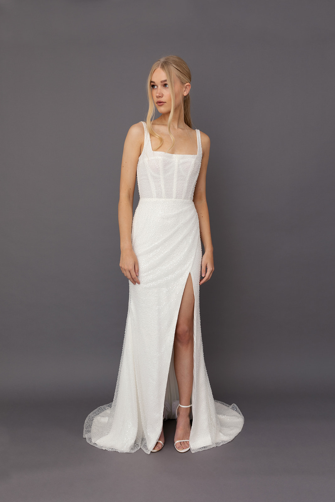 Banks Wedding Dress by Tara Lauren – fully beaded square neck fitted gown with boned corset bodice and draped faux wrap skirt with slit.