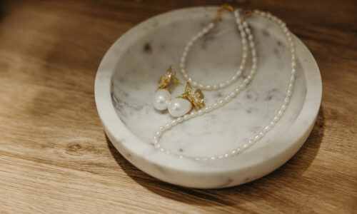 Revelle Bridal Wedding Accessories Ottawa - Bridal Jewelry shop wedding jewellery earrings and necklace in a marble bowl